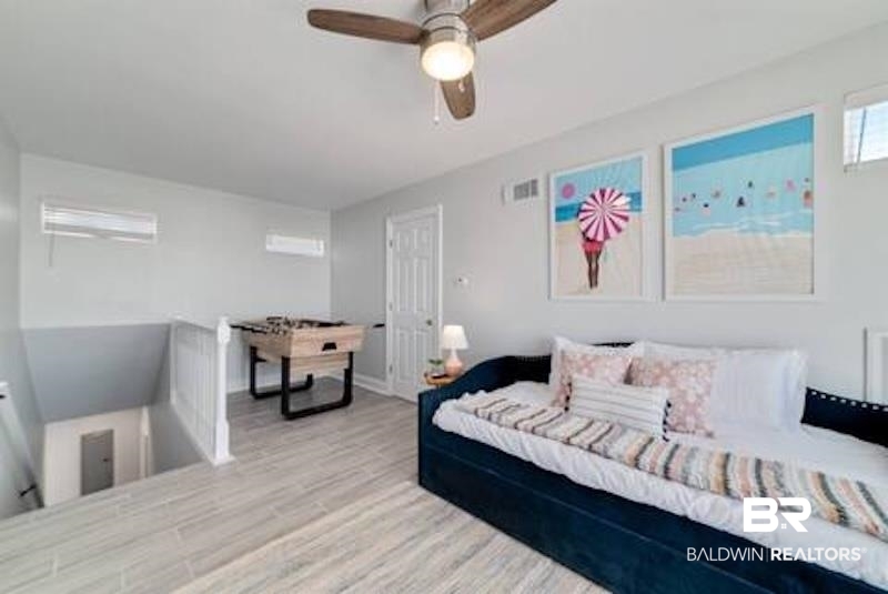 1492 Shell Lane Gulf Shores, AL 36542 - Photo 8 of 20 Bedroom with wood finished floors and ceiling fan