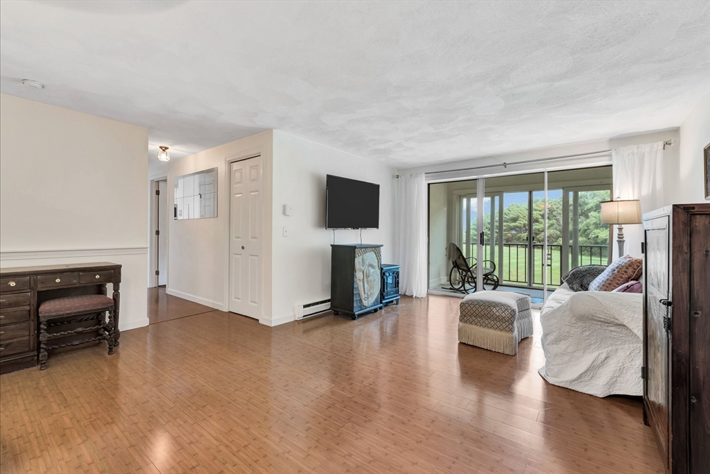 78 Highview Drive, Unit 78 Sandwich, MA 02563 - Photo 13 of 20 a living room with furniture and a fireplace