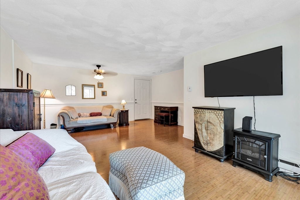 78 Highview Drive, Unit 78 Sandwich, MA 02563 - Photo 14 of 20 a living room with furniture and a flat screen tv
