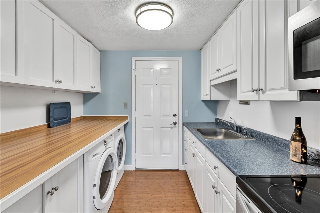 78 Highview Drive, Unit 78 Sandwich, MA 02563 - Photo 4 of 20 a kitchen with granite countertop a sink a stove and cabinets