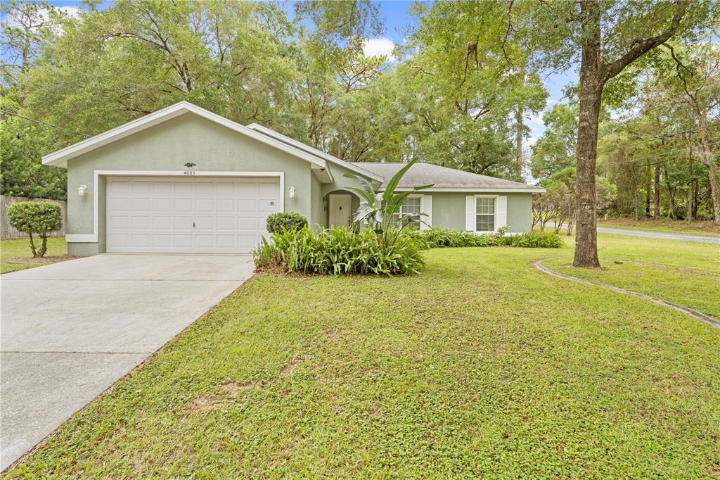 4085 South Fernpark Terrace Inverness, FL 34452 - Photo 1 of 1 a front view of house with yard and green space