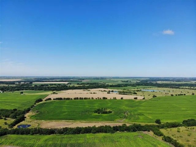 an aerial view of a golf course with a ocean view