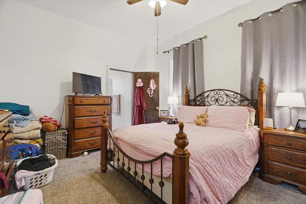 15 Division Street Pittsburgh, PA 15205 - Photo 13 of 44 a bedroom with a bed and a chandelier