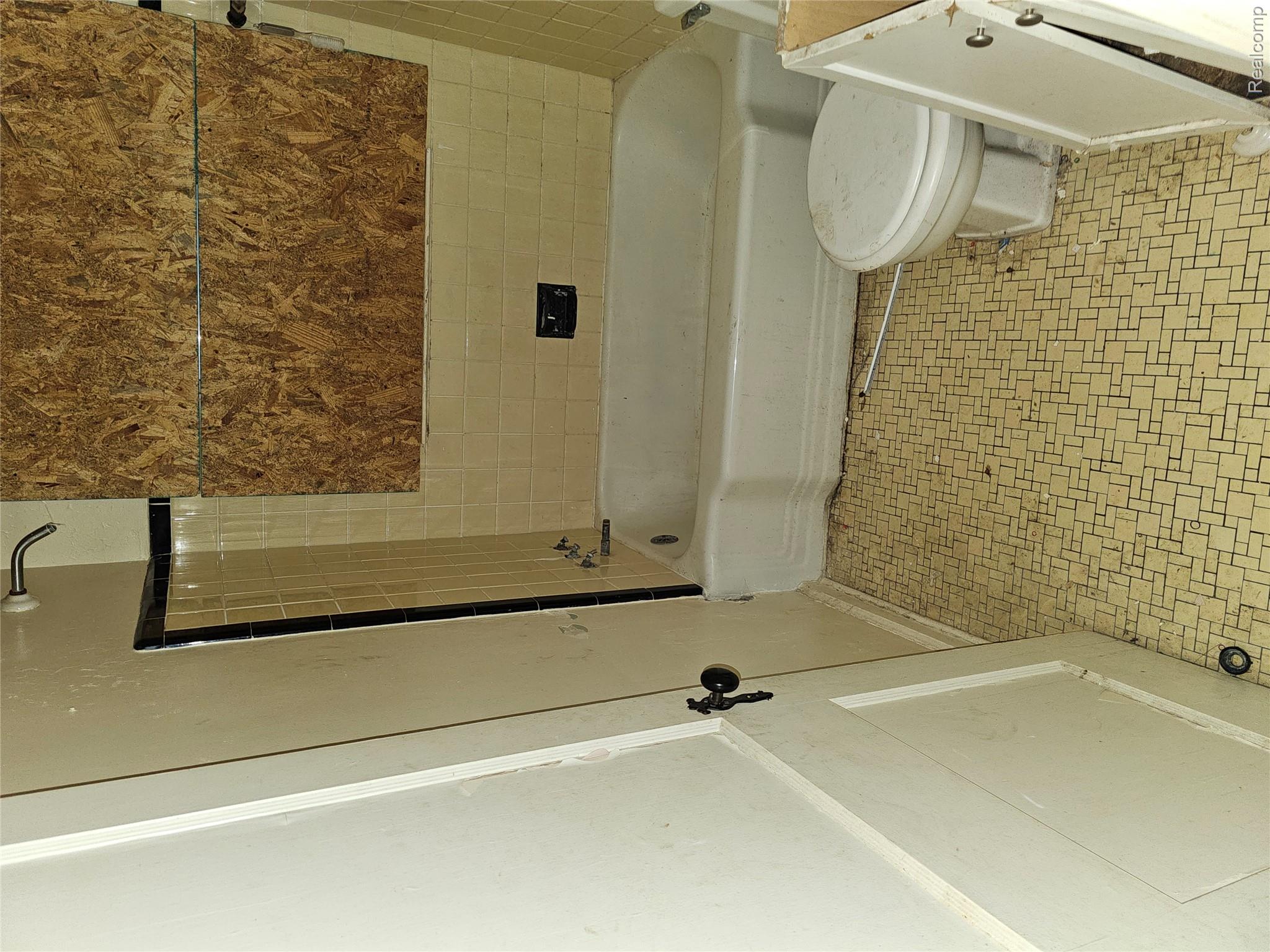 19442 Moross Road Detroit, MI 48224 - Photo 31 of 48 Full bathroom featuring tile patterned floors, shower / bath combination, and vanity