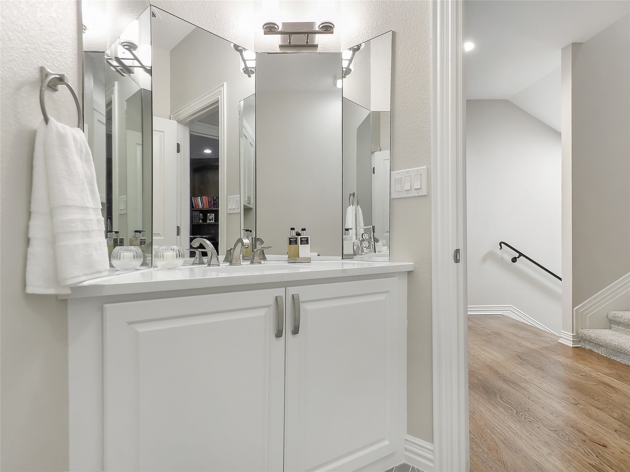 1910 Rue De St Tropez, Unit 4 Austin, TX 78746 - Photo 5 of 27 Bathroom with vanity and light wood finished floors