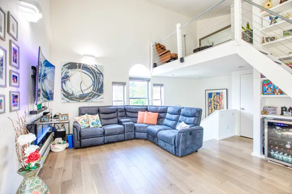 a living room with furniture and a clock