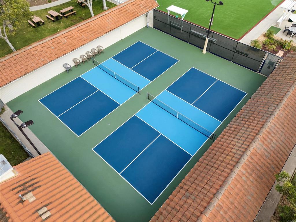 17607 Pomerado Road, Unit 107 San Diego, CA 92128 - Photo 26 of 26 a view of a tennis ground with large screen