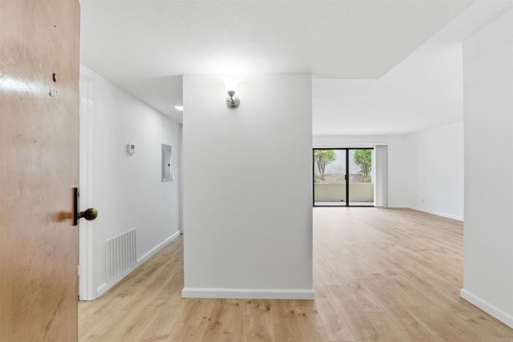 17607 Pomerado Road, Unit 107 San Diego, CA 92128 - Photo 4 of 26 wooden floor in an empty room