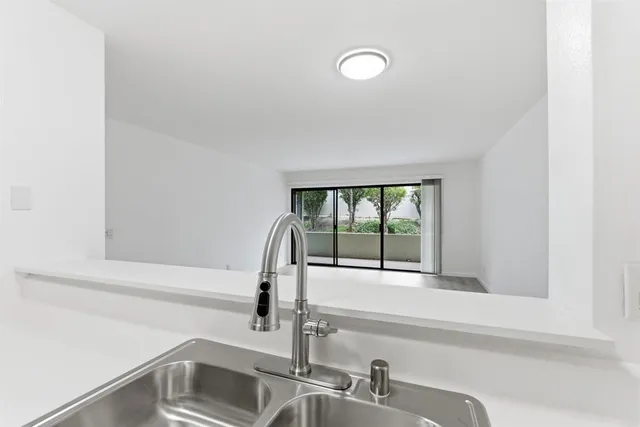 a bathroom with a sink and a window