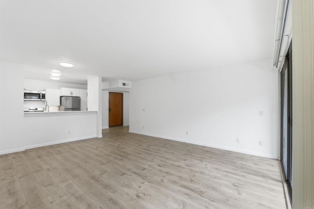 17607 Pomerado Road, Unit 107 San Diego, CA 92128 - Photo 10 of 26 a view of a kitchen with an empty space and a window