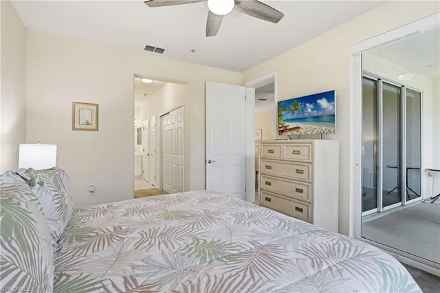 a bedroom with a bed and a tv