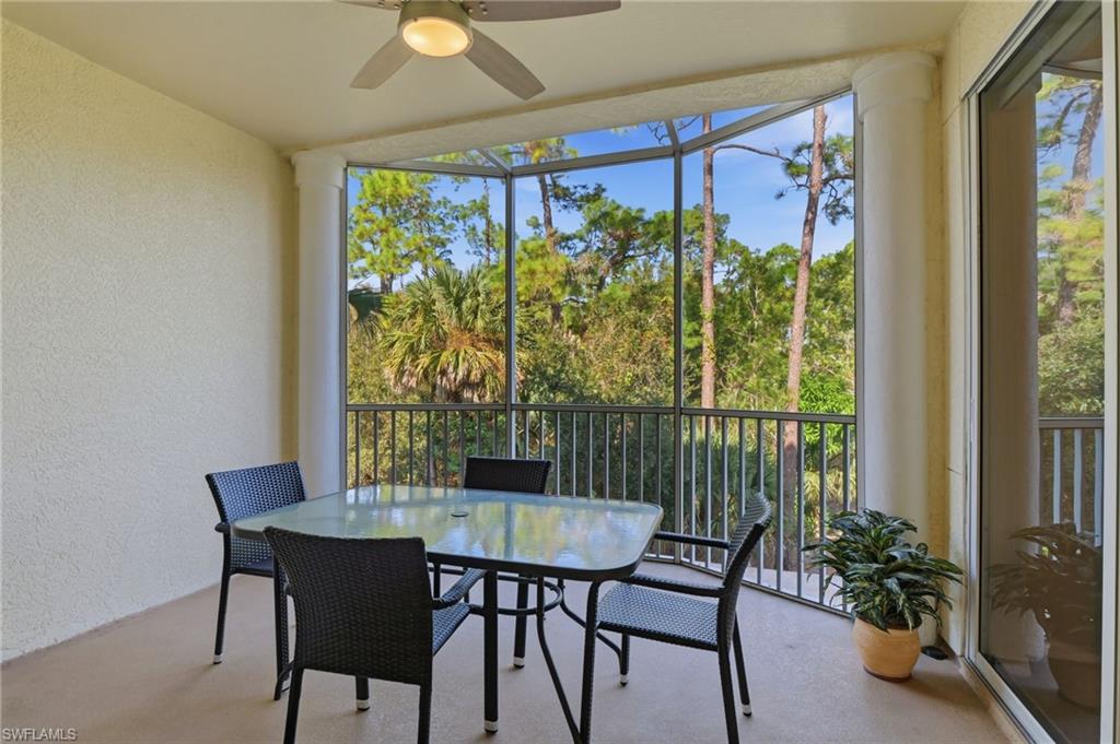 4873 Hampshire Court, Unit 104 Naples, FL 34112 - Photo 24 of 43 a view of a dining room with furniture window and outside view