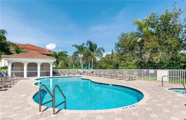 a view of a swimming pool with a patio