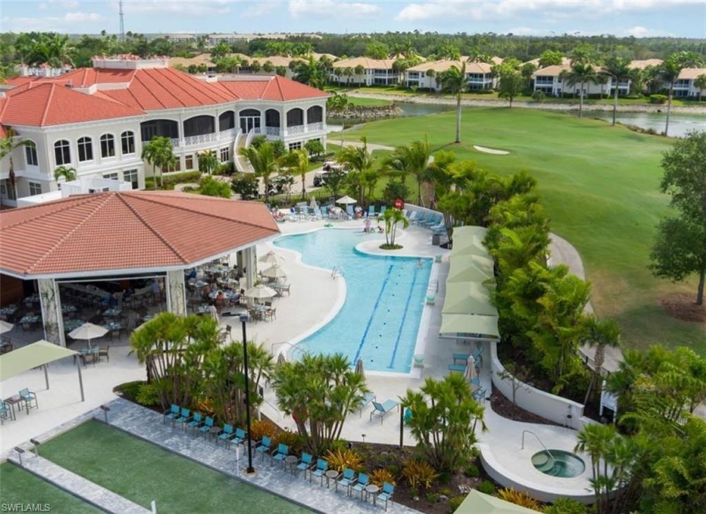 4873 Hampshire Court, Unit 104 Naples, FL 34112 - Photo 29 of 43 an aerial view of a house with garden space and lake view
