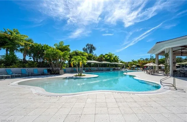 a view of a swimming pool with sitting area