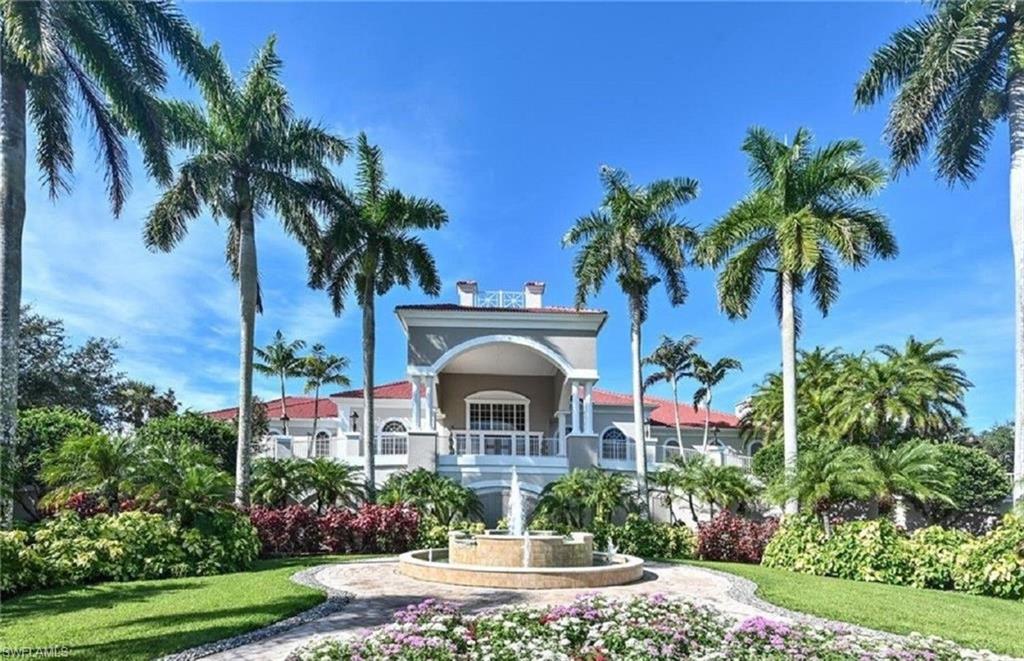 4873 Hampshire Court, Unit 104 Naples, FL 34112 - Photo 32 of 43 a front view of a house with a garden