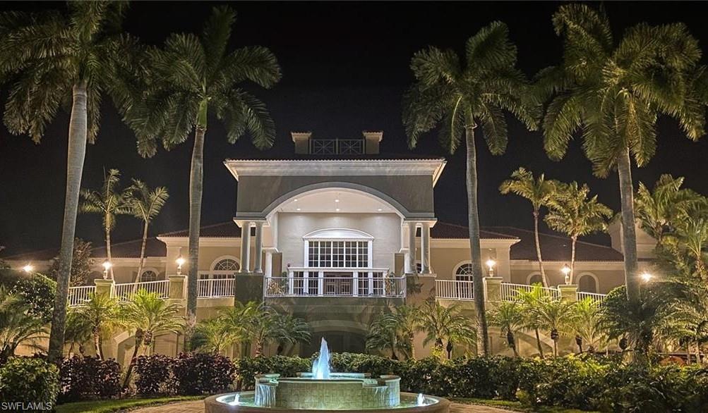 4873 Hampshire Court, Unit 104 Naples, FL 34112 - Photo 33 of 43 a front view of a house with a yard