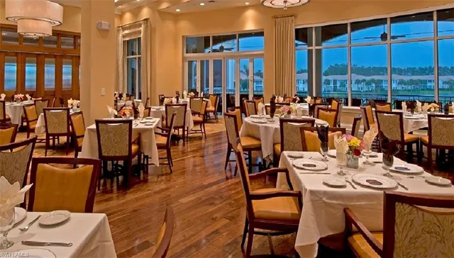 a dining hall with furniture window and wooden floor