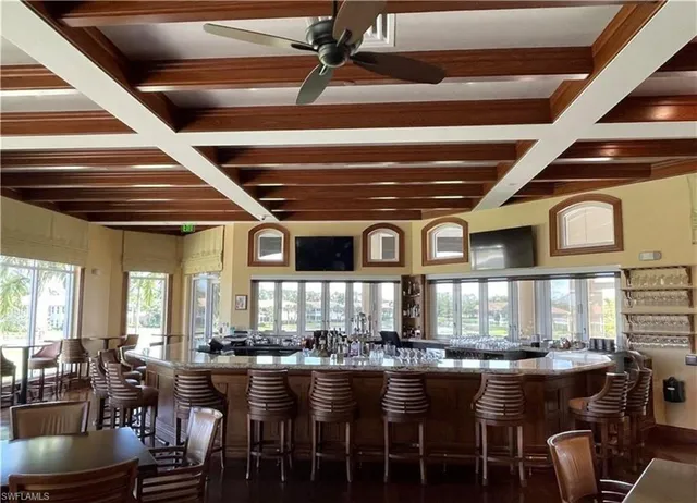 a kitchen with a table and chairs