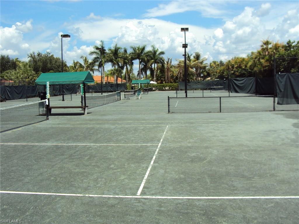 4873 Hampshire Court, Unit 104 Naples, FL 34112 - Photo 39 of 43 a view of a tennis court