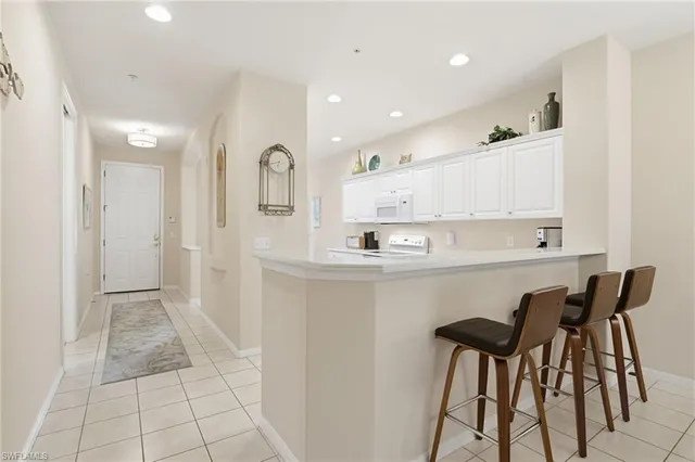 a kitchen with a sink cabinets and window