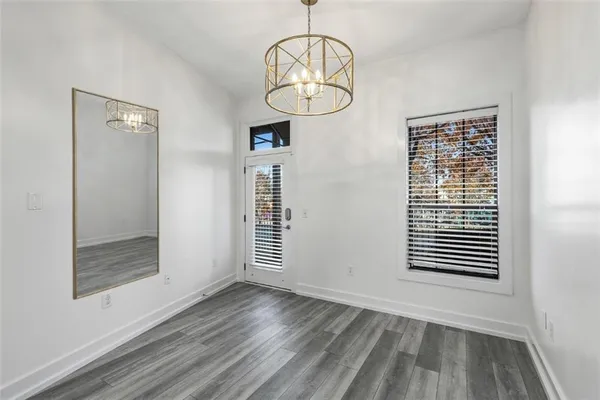 a view of an empty room with glass door