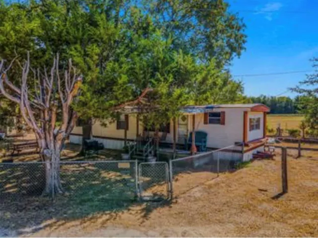 a backyard of a house with seating space