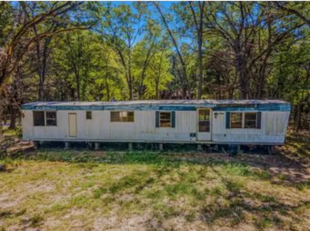 a view of a yard in front of a house