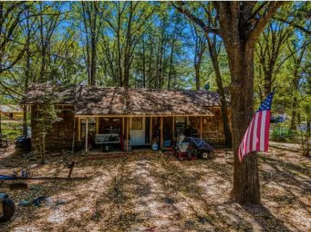 a view of a chairs and tables in the backyard