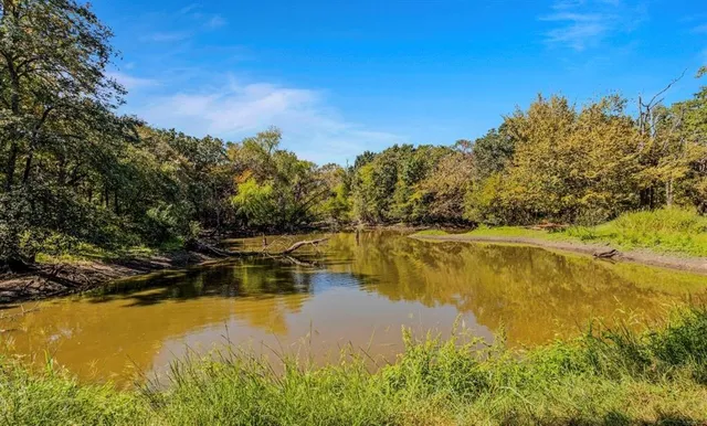 a view of an ocean with a mountain