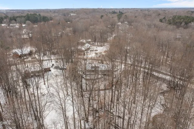 a view of livingroom with hardwood floor and kitchen view