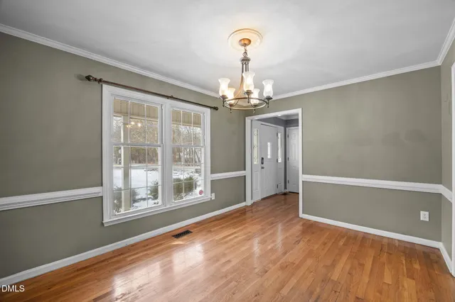a kitchen with stainless steel appliances granite countertop a sink a stove and cabinets