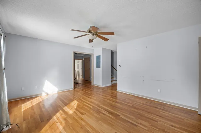 a view of an empty room with a window