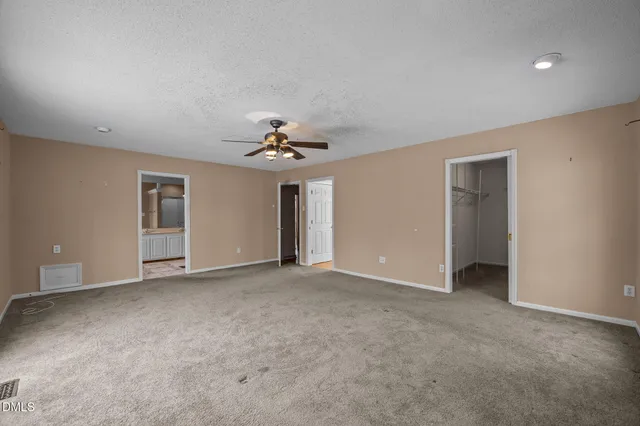 a bathroom with a bathtub and a window