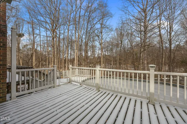 a view of a house with snow on the background