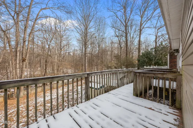 a view of a house with a yard covered with snow in the house