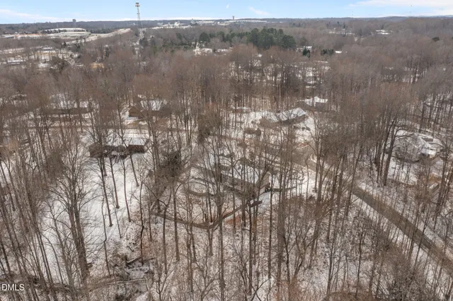 a view of a bedroom with wooden floor
