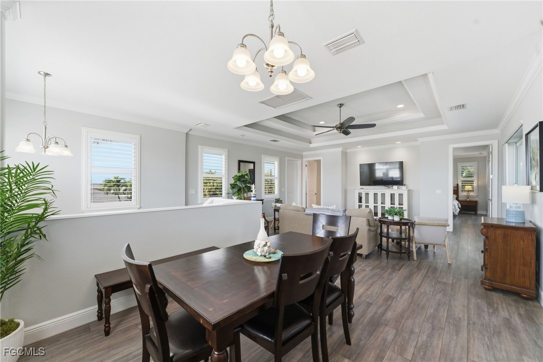 12304 Boat Shell Drive Matlacha Isles, FL 33991 - Photo 14 of 47 a view of a dining room with furniture window and wooden floor