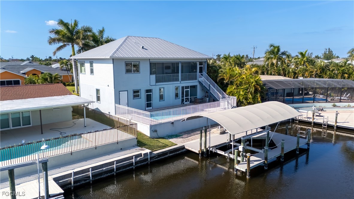 12304 Boat Shell Drive Matlacha Isles, FL 33991 - Photo 2 of 47 a balcony with furniture and a potted plant