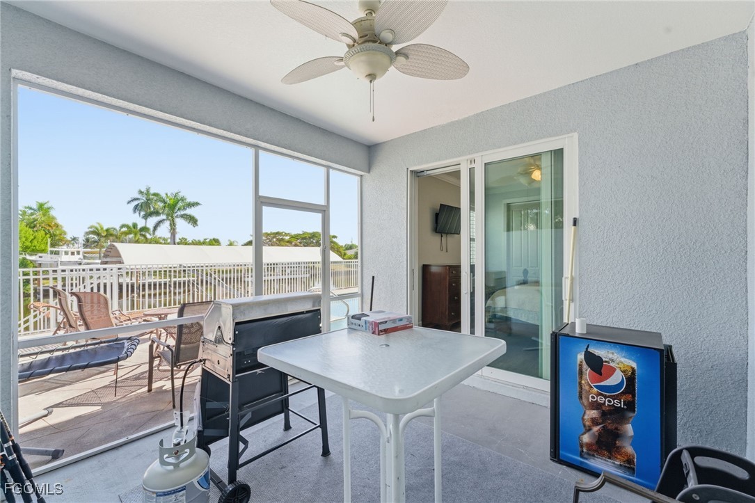 12304 Boat Shell Drive Matlacha Isles, FL 33991 - Photo 31 of 47 a view of a dining room with furniture window and outside view