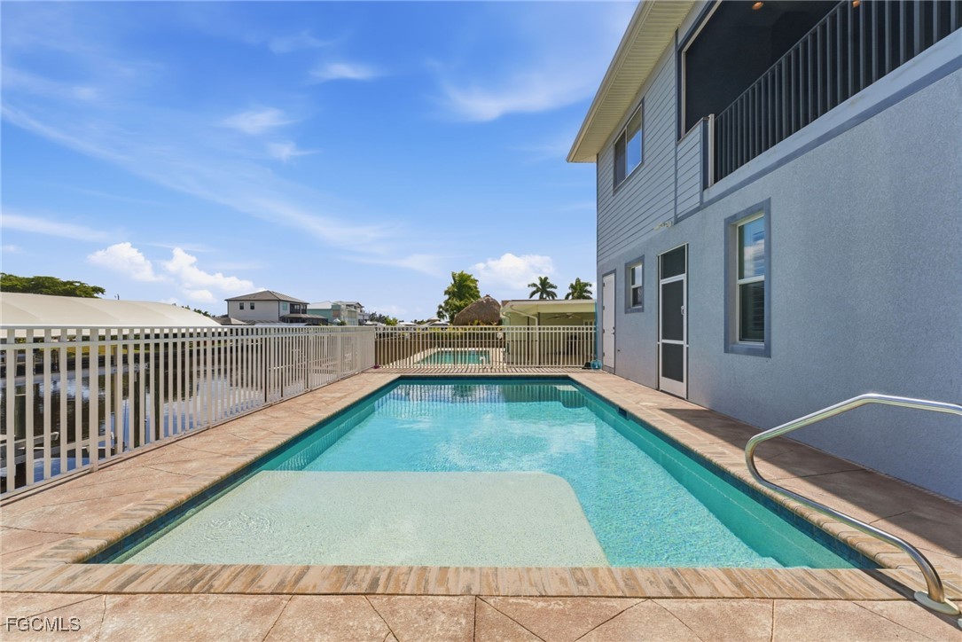12304 Boat Shell Drive Matlacha Isles, FL 33991 - Photo 33 of 47 a view of swimming pool with lounge chair