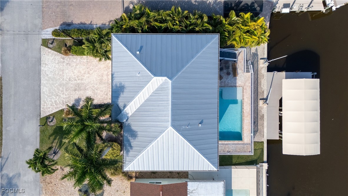 12304 Boat Shell Drive Matlacha Isles, FL 33991 - Photo 43 of 47 an aerial view of a house with a yard and potted plants