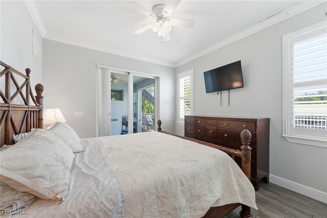 12304 Boat Shell Drive Matlacha Isles, FL 33991 - Photo 5 of 47 a bedroom with a bed and a flat screen tv
