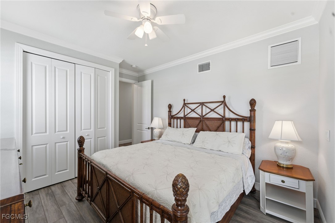 12304 Boat Shell Drive Matlacha Isles, FL 33991 - Photo 6 of 47 a bedroom with a bed and a chandelier