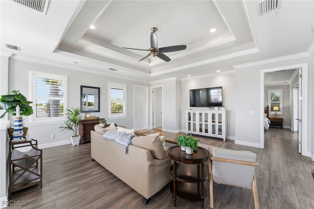 12304 Boat Shell Drive Matlacha Isles, FL 33991 - Photo 9 of 47 a living room with furniture a flat screen tv and a table