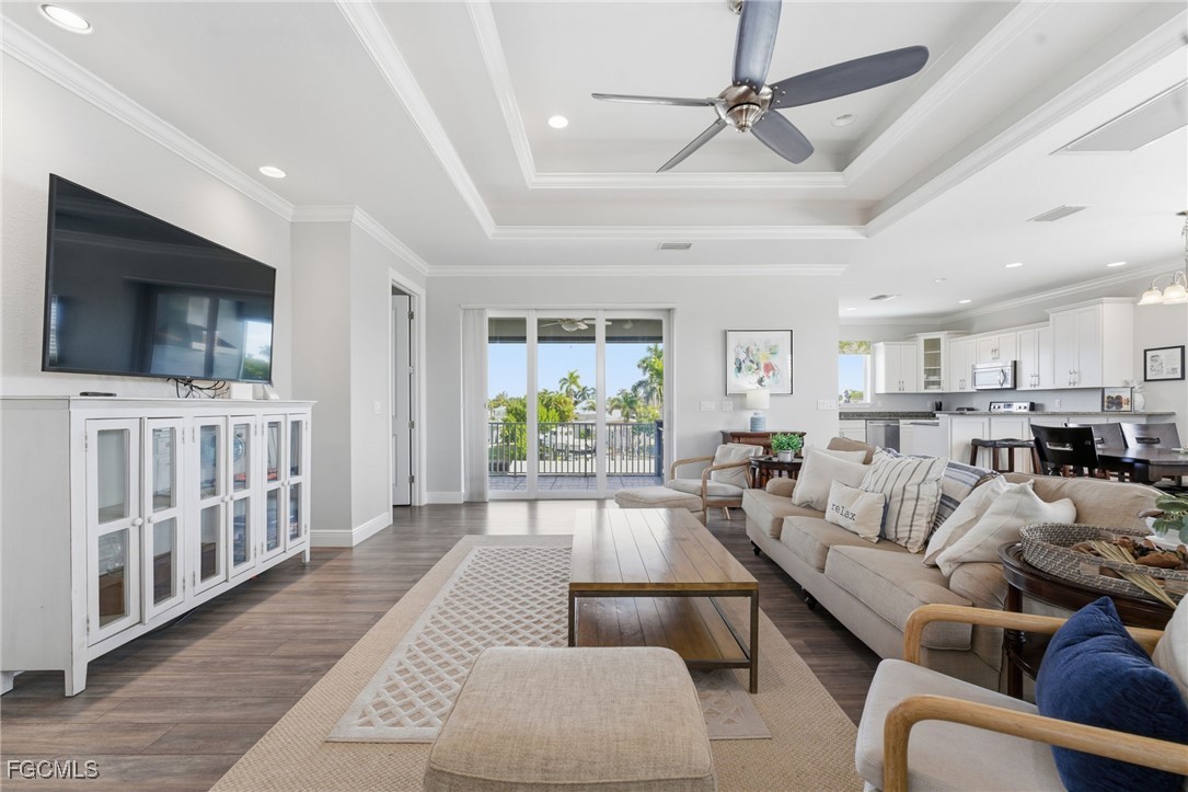 12304 Boat Shell Drive Matlacha Isles, FL 33991 - Photo 10 of 47 a living room with furniture and a flat screen tv
