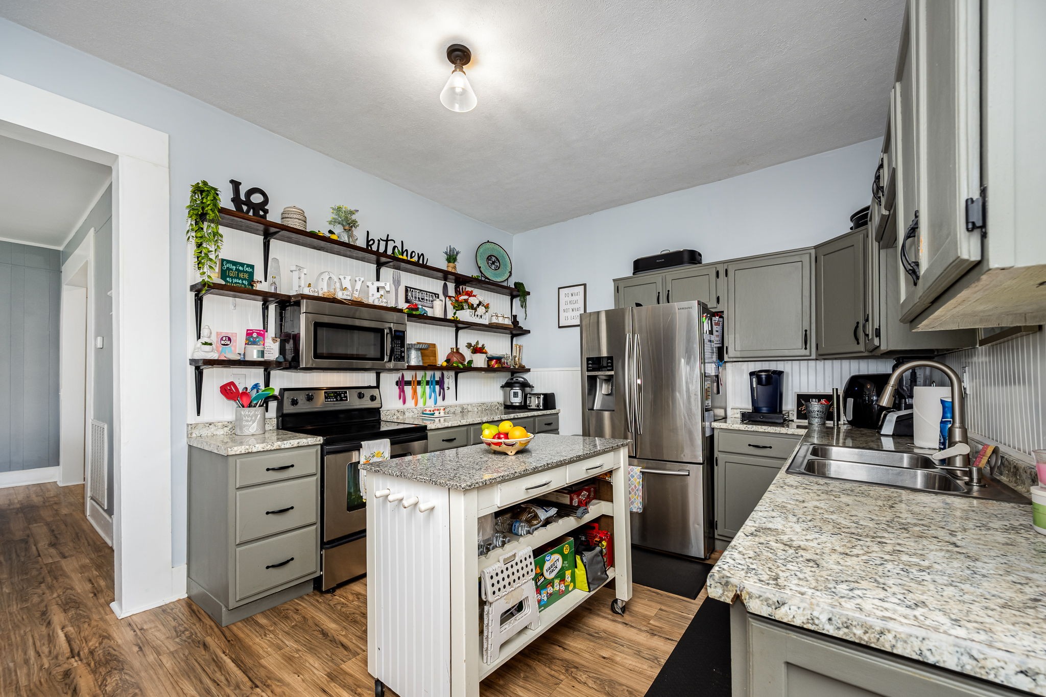 634 Highway 52 Portland, TN 37148 - Photo 15 of 42 a kitchen with stainless steel appliances a stove refrigerator and a sink