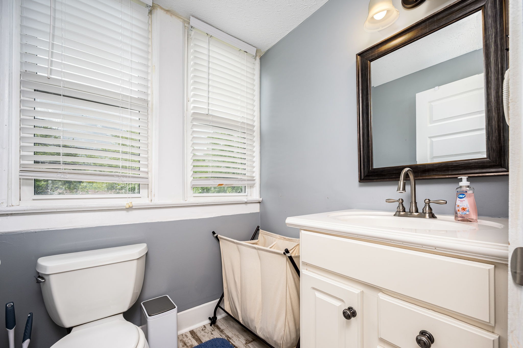 634 Highway 52 Portland, TN 37148 - Photo 30 of 42 a bathroom with a toilet sink and mirror