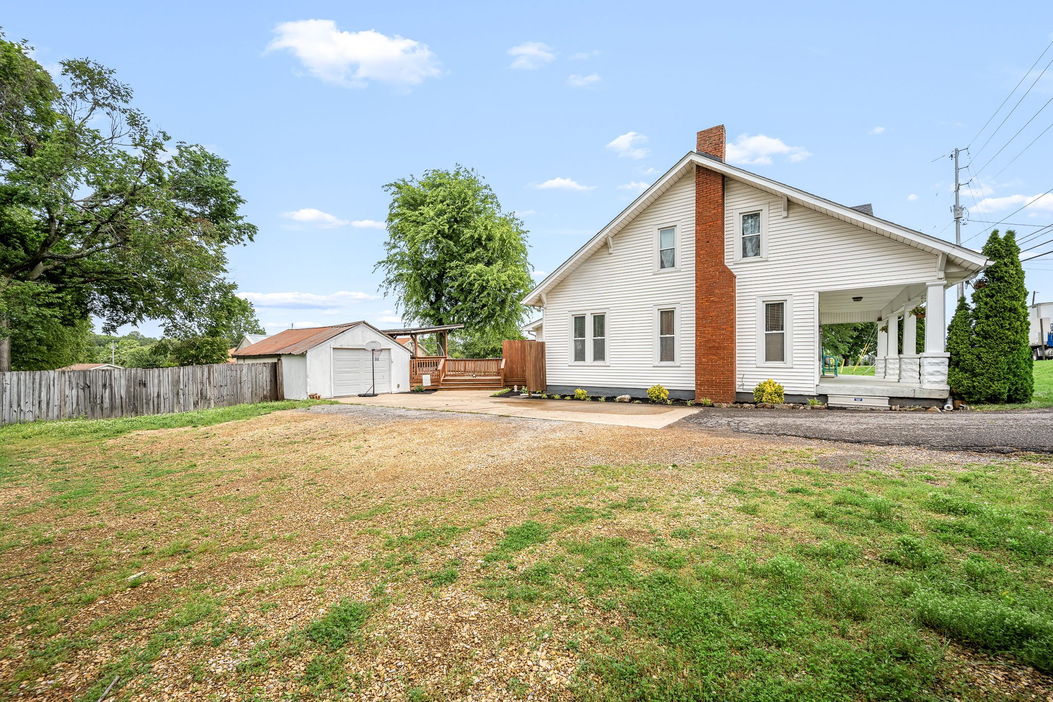 634 Highway 52 Portland, TN 37148 - Photo 40 of 42 a view of a house with backyard and trees