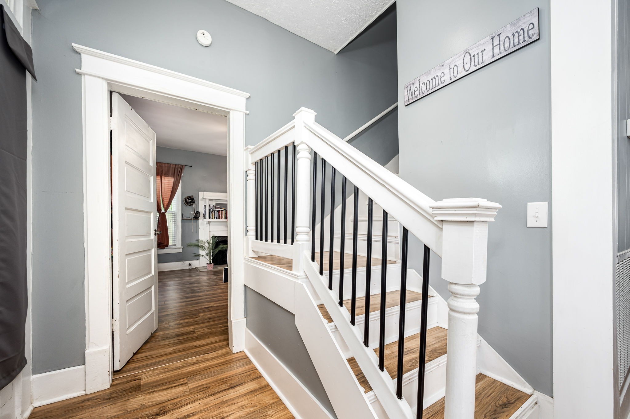 634 Highway 52 Portland, TN 37148 - Photo 8 of 42 a view of a hallway with wooden floor and staircase